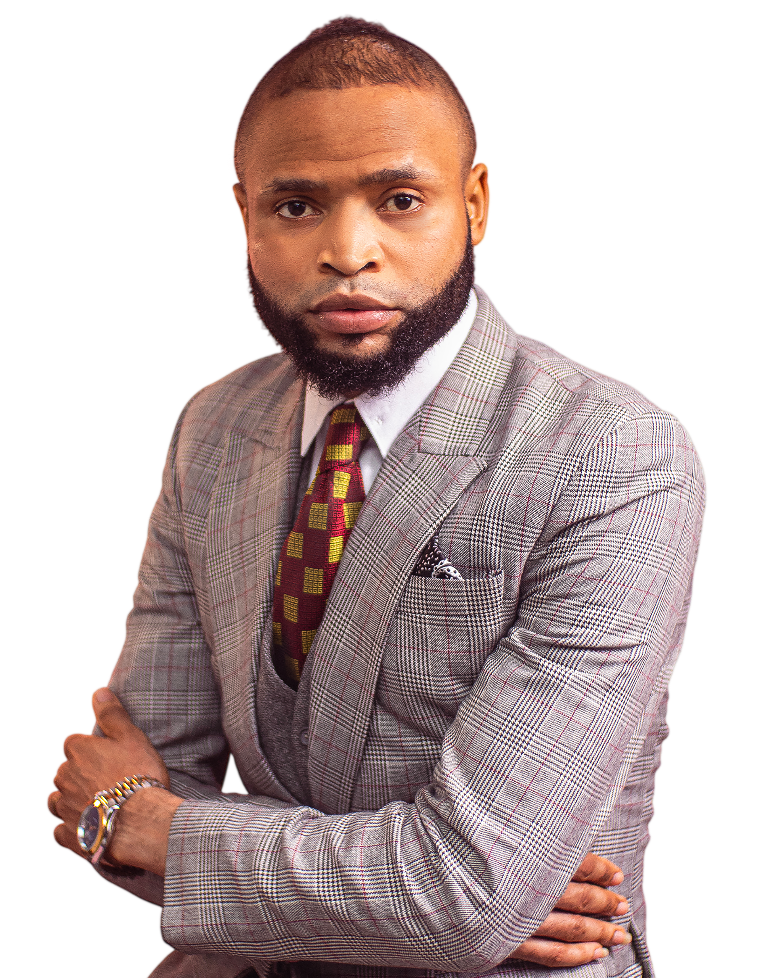 Pst. Emmanuel Eigbe, arms crossed, in a grey plaid suit